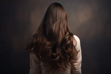 Foto op Canvas Young woman with long curly hair on dark background. Back view, rear view of a Beautiful young woman with long hair. back view of a girl with flying hair, AI Generated © Iftikhar alam