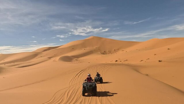 quad in the dunes of the sahara