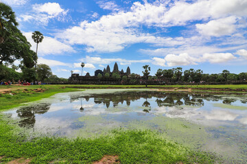 Angkor Wat Temple Complex reflected in the lake at Midday - UNESCO World Heritage 12th century...