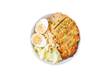 Ramen noodles with meat schnitzel slices, peking cabbage, eggs and scallions on a white isolated background