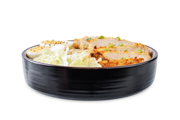 Ramen noodles with meat schnitzel slices, peking cabbage, eggs and scallions on a white isolated background