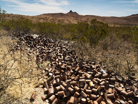 Pile of tin cans in the desert ghost town of Lake Valley, New Mexico