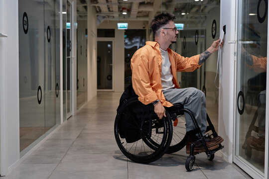 Man using electronic key to open the office door