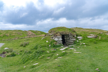 Cave in a pasture to protect grazing animals - 678781188