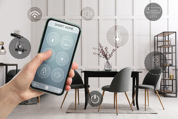 Woman using smart home control system via application on mobile phone indoors, closeup. Different icons around