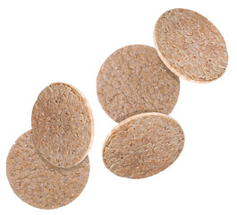 Many tasty crispbreads falling on white background