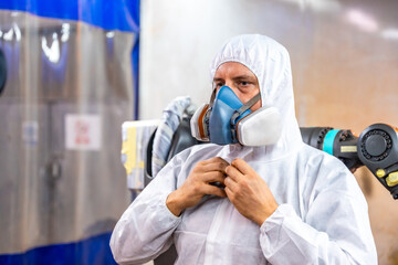 Industrial painter wearing safety uniform to work