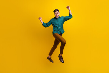 Fototapeta na wymiar Photo of overjoyed cheerful glad man dressed stylish clothes celebrate black friday offer proposition isolated on yellow color background