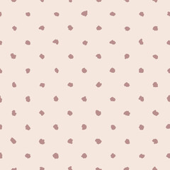 Seamless pattern with hand drawn spots on beige background. Simple abstract design for baby clothes.