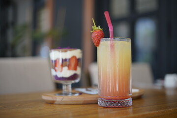 cocktail with strawberry and cake