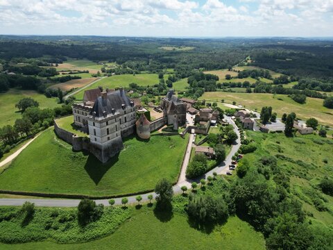 Biron castle Chateau Dordogne France aerial high angle..