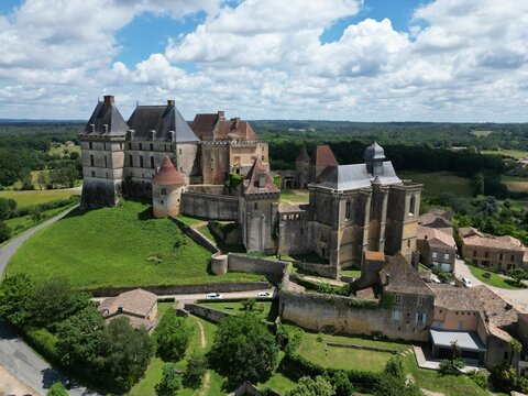 Biron castle Chateau Dordogne France aerial..