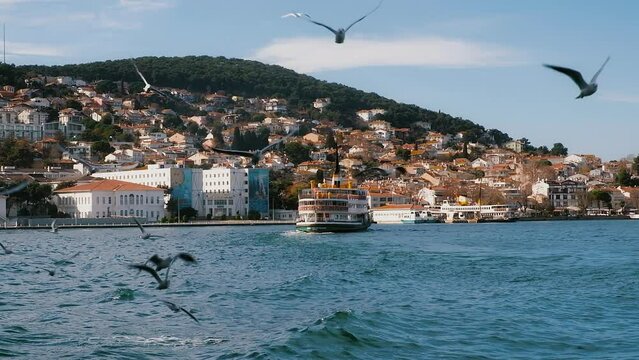 Ferry boat on background of coastline of Island Burgazada in the Sea of Marmara