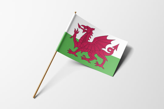 Wales flag of small paper, isolated on white background