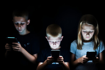 Unhappy young kids hypnotized with mobile phones and smartphones. Children in technology isolation and emotional depression. Internet and social media
