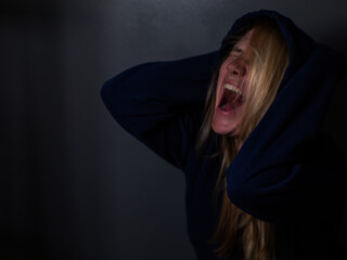 Woman screaming in agony