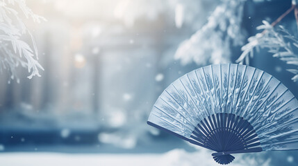 Traditional Japanese fan with snow winter landscape background