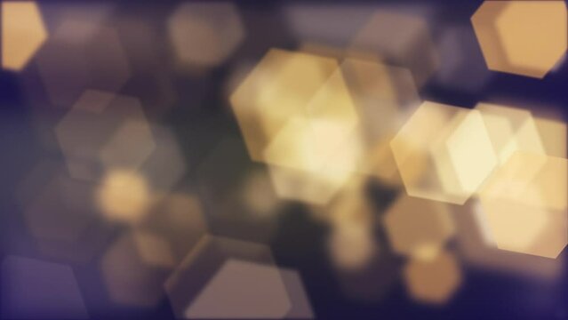Abstract bokeh background animation with gently flickering defocused warm golden bokeh light hexagons. This elegant motion background is full HD and a seamless loop.