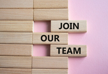 Join our team symbol. Wooden blocks with words Join our team. Beautiful pink background. Business and Join our team concept. Copy space.
