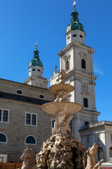 Fountain in front of the baroque cathedral in Salzburg, Austria