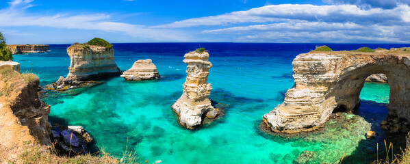 Italian summer holidays. Wonderful sea scenery in Puglia. "Torre di Sant Andrea" - famous rock formations near Otranto and popular beach. Italy.
