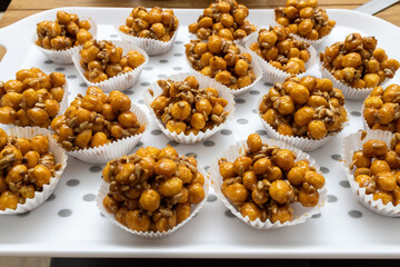 Caramelized peas, wedding sweets in a baking tray