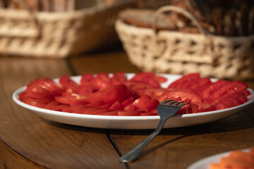sliced red tomato on plate