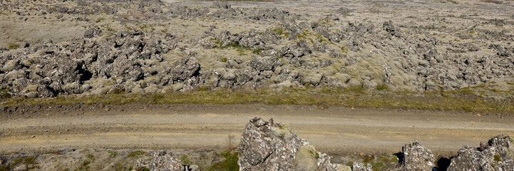 A view of the dirt road among the lava fields. Helgafellssveit, Iceland.