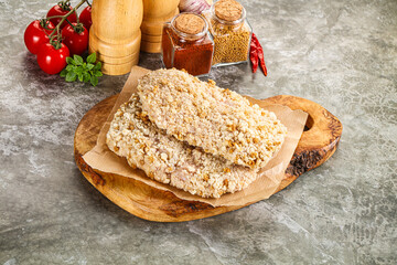 Breaded raw breaded meat schnitzel