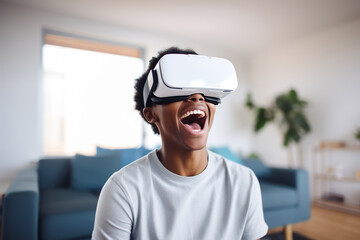 Happy african american teenager wearing virtual reality glasses at home. Augmented reality