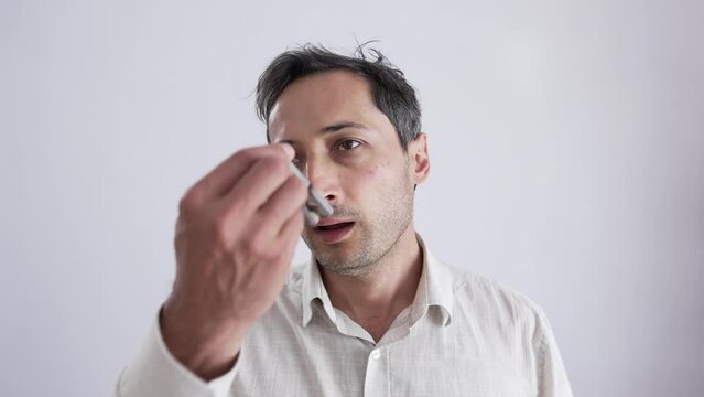 Bad breath concept. Man uses clothespin on his nose
