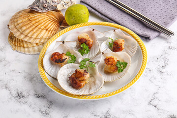Grilled scallops shell with butter