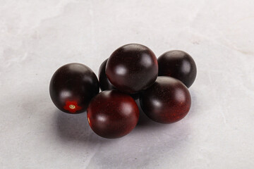 Raw ripe black kumato tomato
