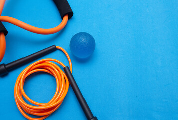 various gym and pilates equipment on the blue background