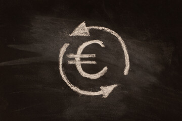 Euro badge with arrows written in chalk on black board.