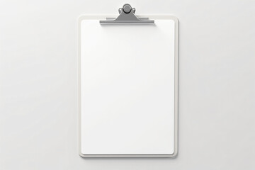 Blank white clipboard on a light surface