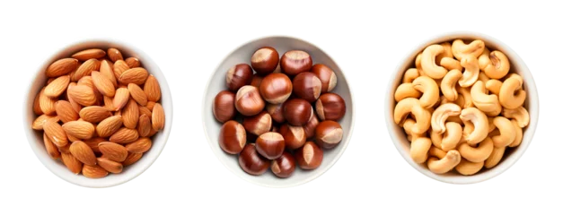 Fotobehang Top view of three bowls full of almonds, hazelnuts and cashews over isolated transparent background © Pajaros Volando