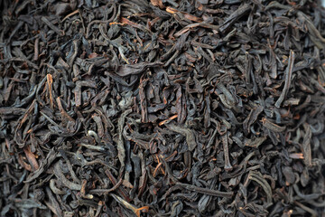 Close-up of red tea leaves from China. Macro photo, top view, flat lay. Tea drinking tradition,...