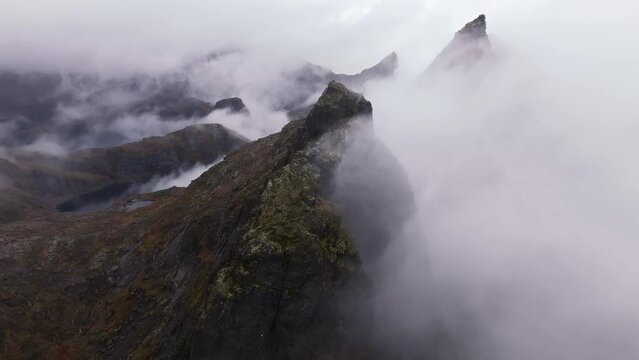 Cloudscape Over Norway: 4K Drone Footage Revealing the Dramatic Beauty of Jagged Mountain Peaks