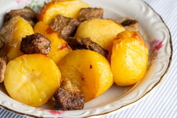 From traditional delicious Turkish food; potato and meat dish in casserole (Turkish name; Guvec tas kebabi, tandir)