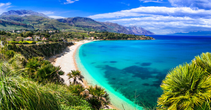 Wide Panorama of Guidaloca Beach in Sicily &mdash; Tropical Turquoise Bay with Palm Trees and Crystal Clear Water near Scopello, Castellammare del Golfo Italy