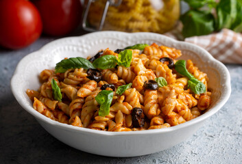 Basil leaves on pasta with arabiata sauce