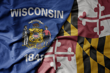 Fototapeta premium big waving colorful national flag of maryland state and flag of wisconsin state .