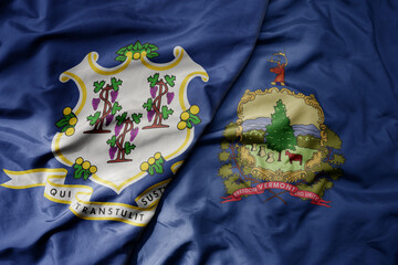 big waving colorful national flag of vermont state and flag of connecticut state .