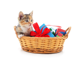 Red kitten in a basket with gifts.