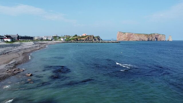 City of Perce, postcard and symbol of the province of Quebec in Canada. Blue water beach on a sunny day. Prominent and very beautiful rock!