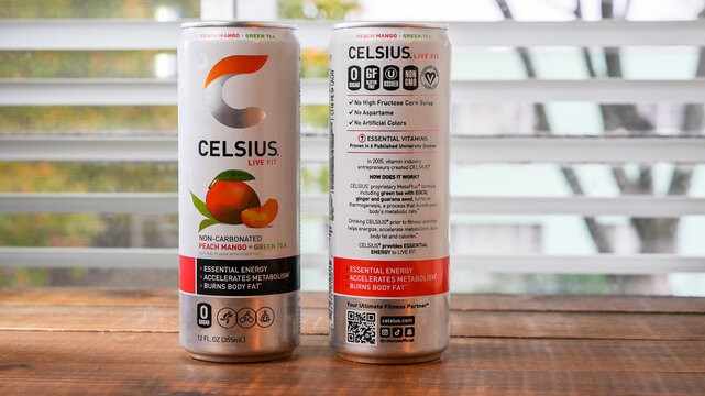 NORWALK, CT, USA - NOVEMBER 10, 2023: Celsius live fit non carbonated drink in can on wooden table near window