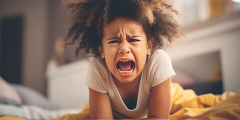 Little angry girl shouting in her room. Concept of emotions and family relation. - obrazy, fototapety, plakaty