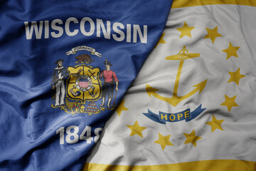 big waving colorful national flag of rhode island state and flag of wisconsin state .