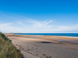 Cambois beach in Northumberland at low tide with old sewage pipe.